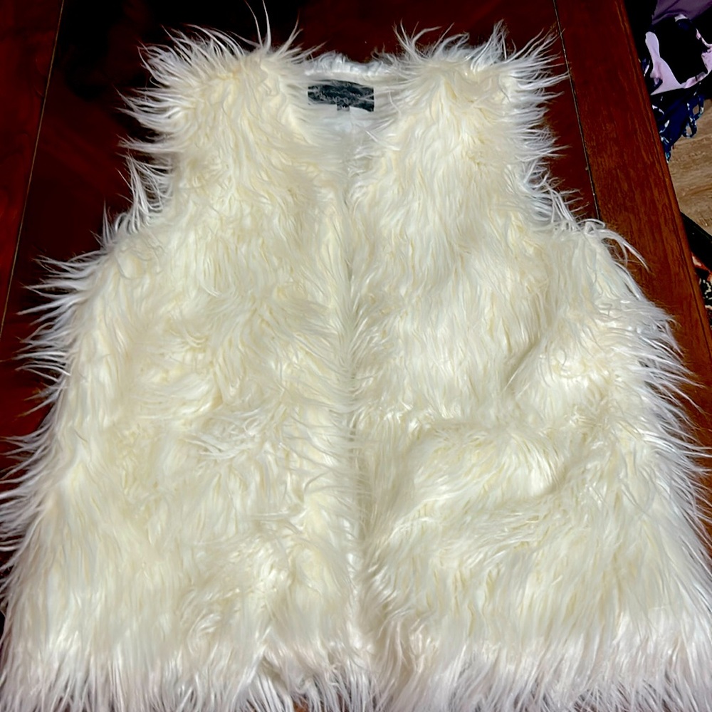 White furry vest
